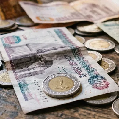 Egyptian currency banknote and coins