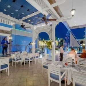 Indoor dining area showing the Greek-inspired atmosphere at Koutouki Soho Square