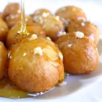 Loukoumades Greek honey donuts with cinnamon and walnuts at Koutouki Restaurant Soho Square Sharm El Sheikh