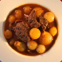 Mosharisio Stifado traditional Greek beef stew with shallots at Koutouki Restaurant Soho Square Sharm El Sheikh