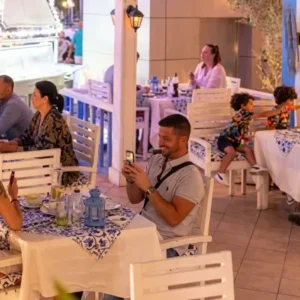 People enjoying their evening and dining at Koutouki restaurant in Soho Square